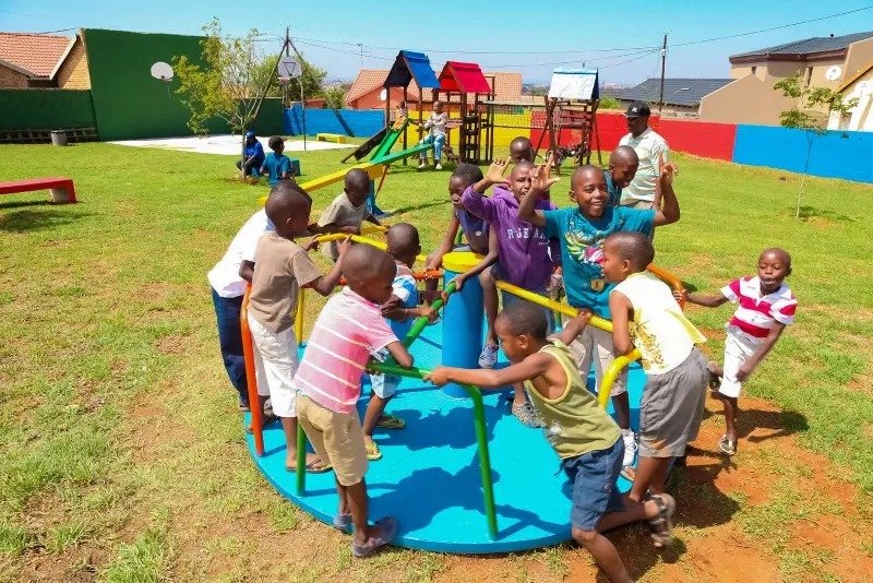 soweto south africa december african kids playing merry go round other park equipment local public playground african kids 181265001